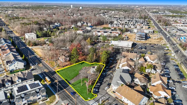 an aerial view of a residential houses with outdoor space