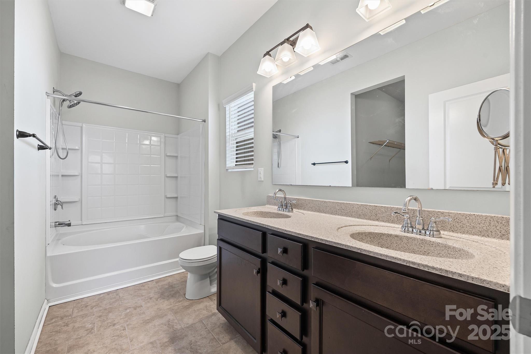 730 Gants Road York, SC 29745 - Photo 20 of 37 a bathroom with a granite countertop sink a toilet a mirror a bathtub and shower
