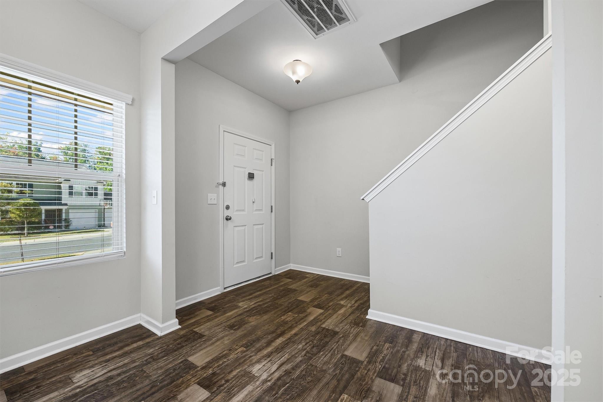 730 Gants Road York, SC 29745 - Photo 3 of 37 a view of an empty room with wooden floor and a window