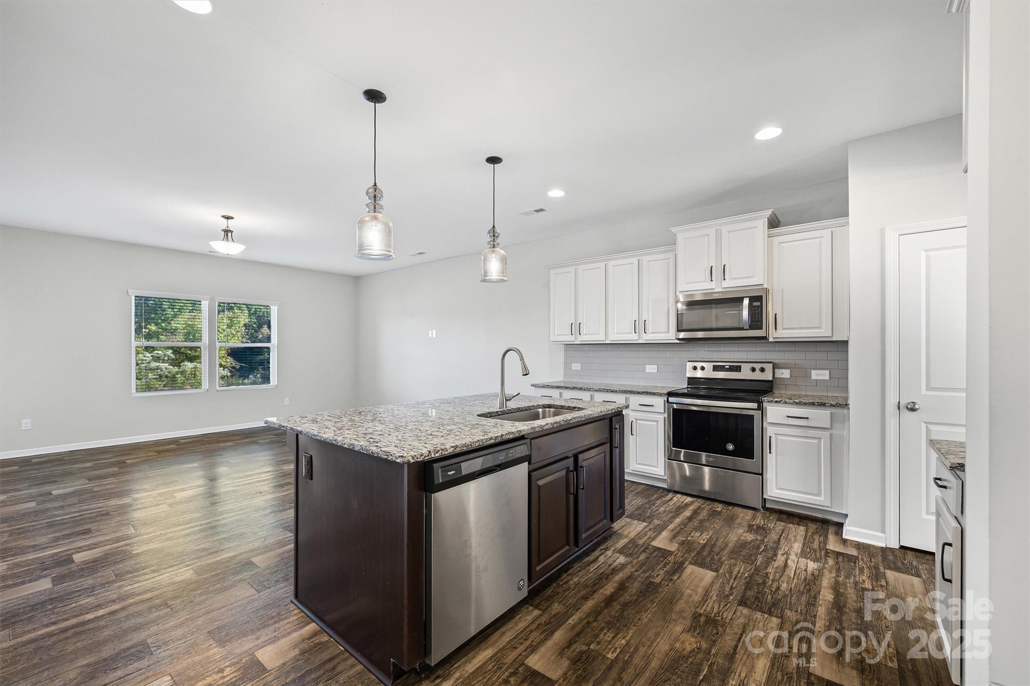 730 Gants Road York, SC 29745 - Photo 7 of 37 a kitchen with stainless steel appliances granite countertop a stove a sink and a refrigerator