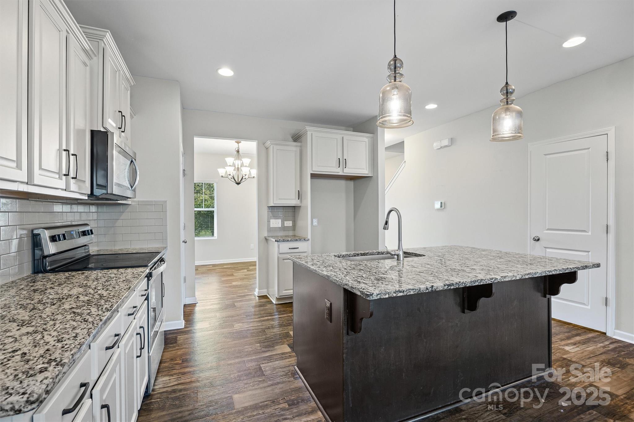 730 Gants Road York, SC 29745 - Photo 9 of 37 a kitchen with stainless steel appliances granite countertop a sink stove and refrigerator