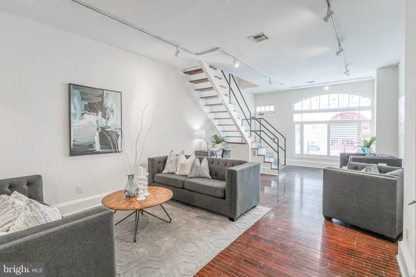 a living room with furniture and a table