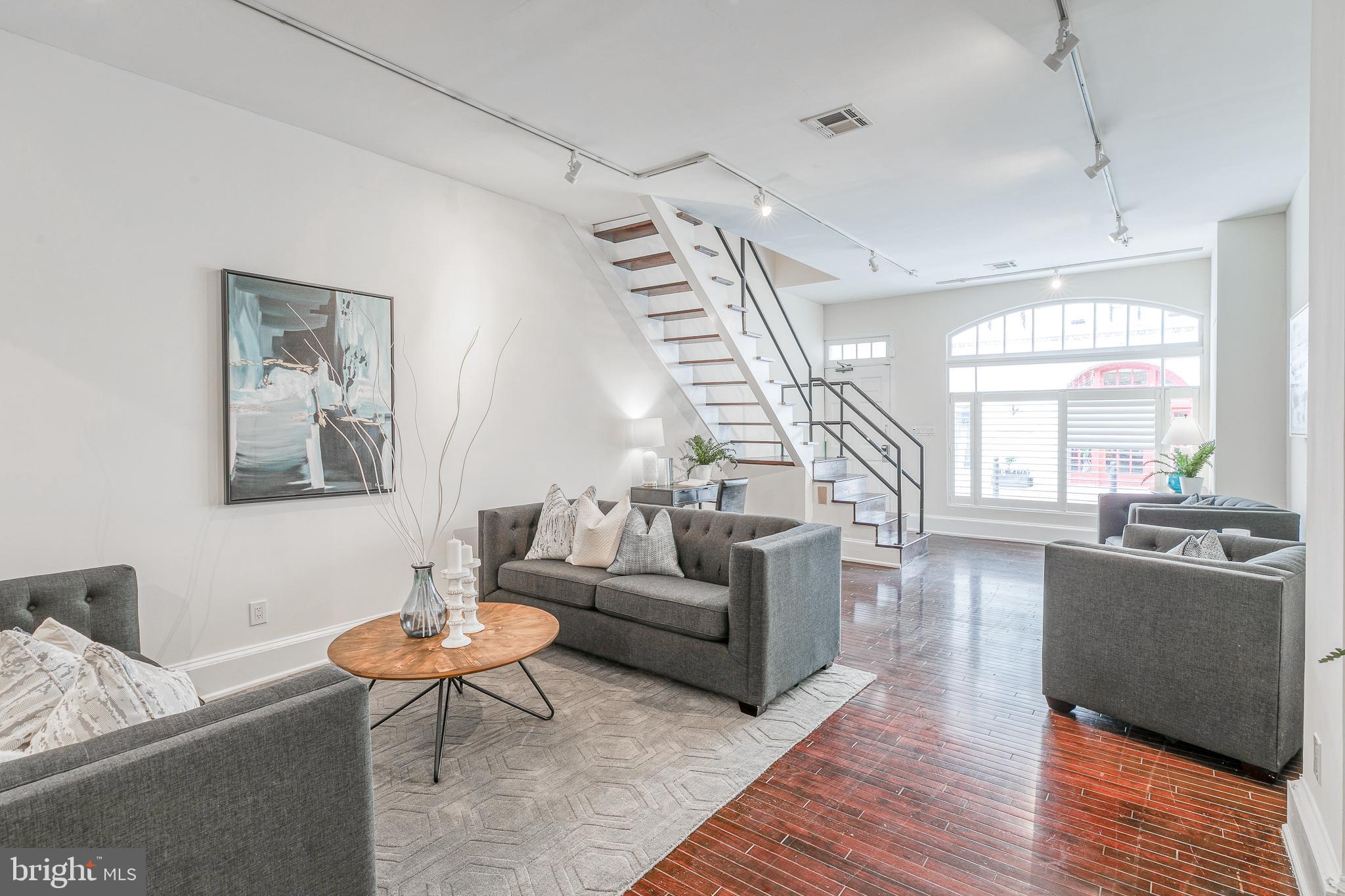 a living room with furniture and a table