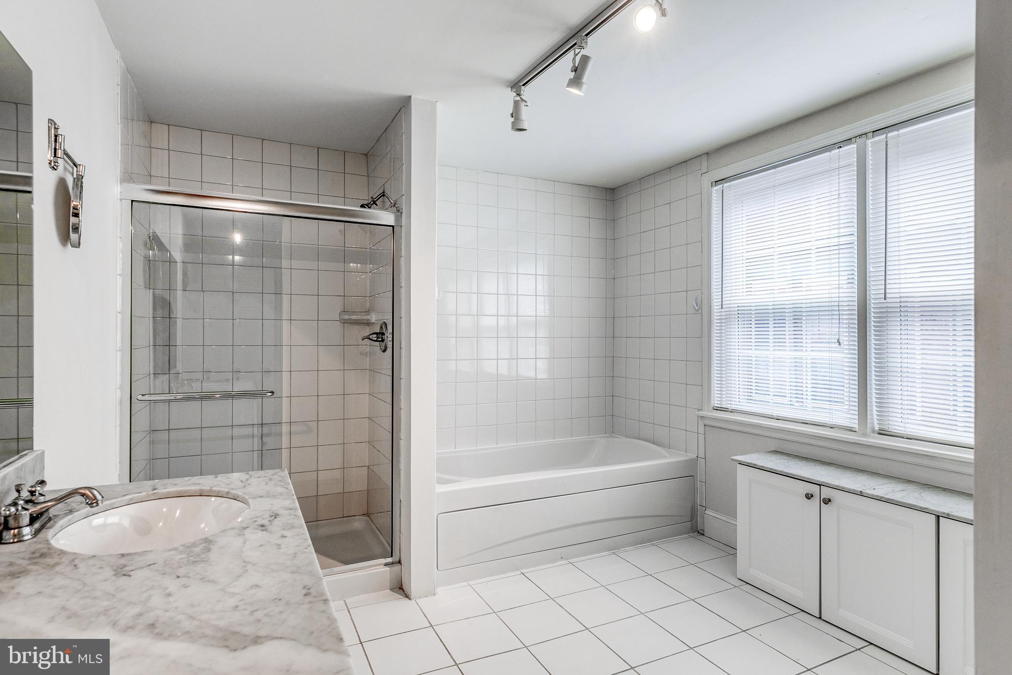 1714 Rittenhouse Square Philadelphia, PA 19103 - Photo 11 of 21 a bathroom with a bathtub and a shower