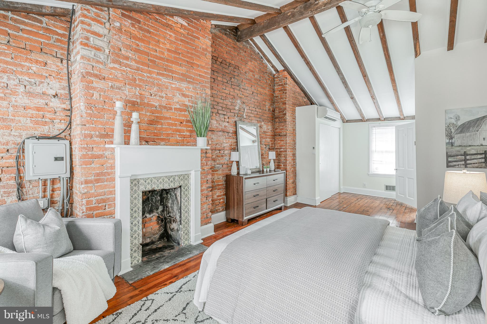 1714 Rittenhouse Square Philadelphia, PA 19103 - Photo 15 of 21 a bed room with a bed and a fireplace