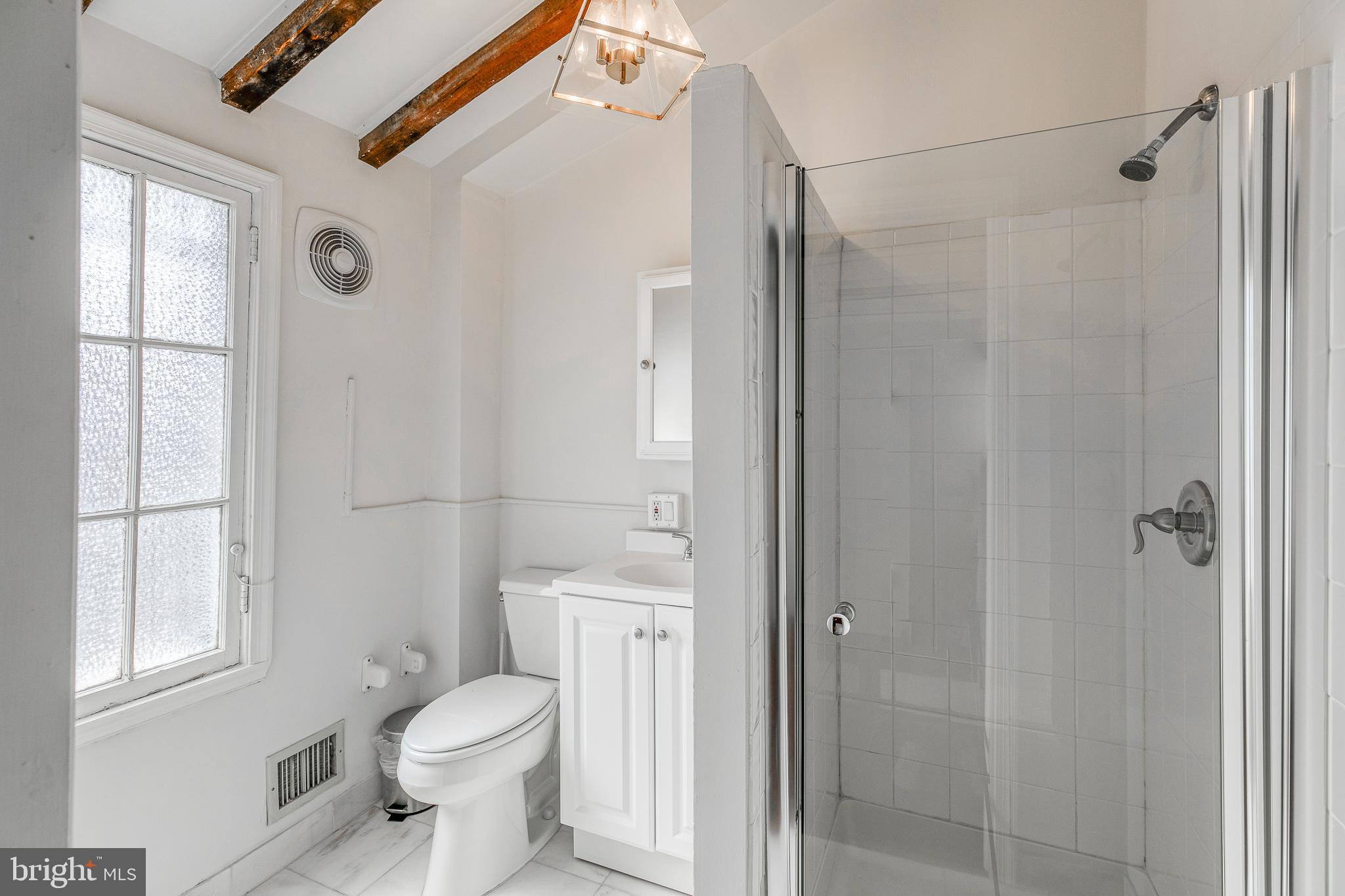 1714 Rittenhouse Square Philadelphia, PA 19103 - Photo 17 of 21 a bathroom with a toilet a sink and shower