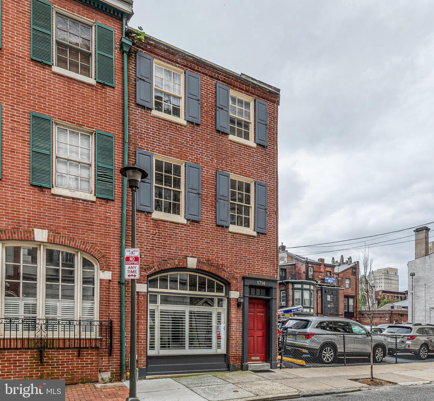 1714 Rittenhouse Square Philadelphia, PA 19103 - Photo 2 of 21 a front view of a building with lot of cars and trees