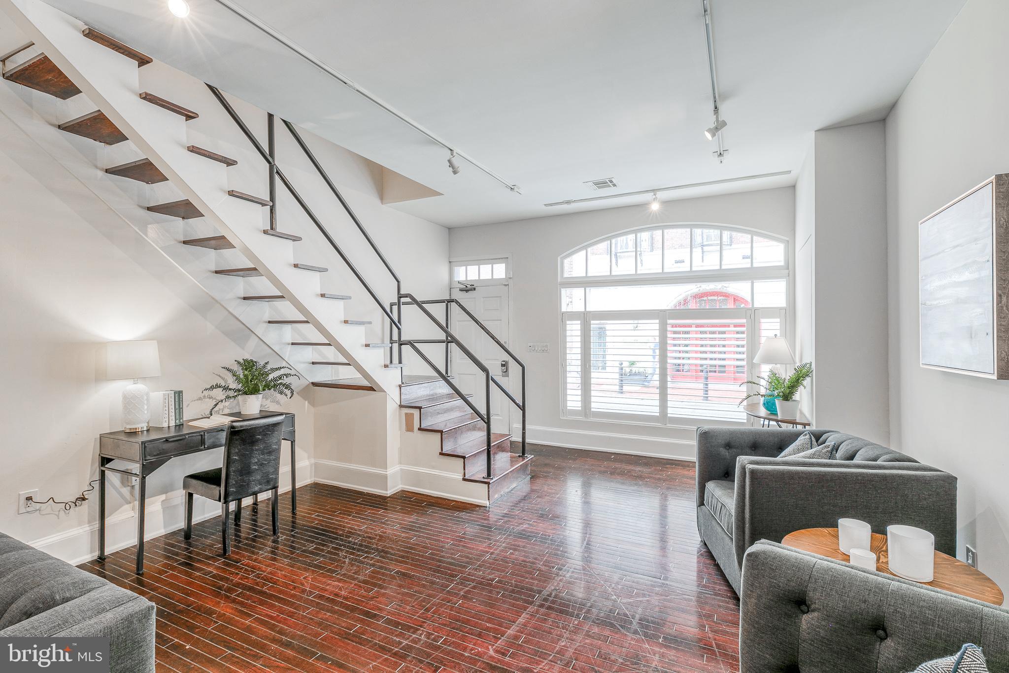 1714 Rittenhouse Square Philadelphia, PA 19103 - Photo 3 of 21 a living room with furniture and a large window