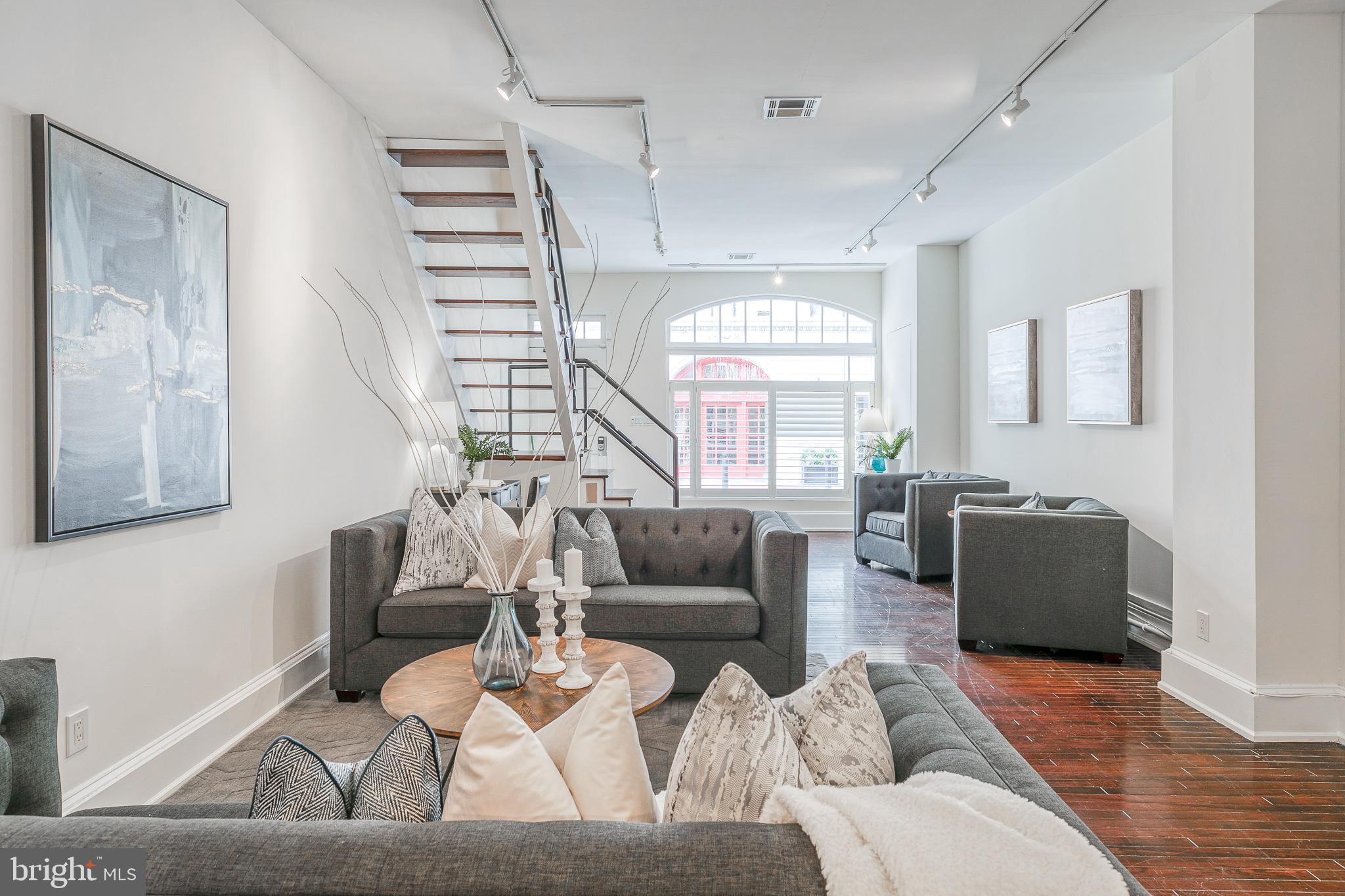1714 Rittenhouse Square Philadelphia, PA 19103 - Photo 4 of 21 a living room with furniture and a large window
