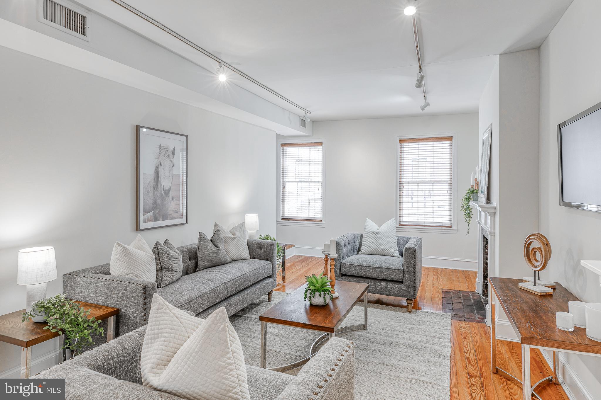 1714 Rittenhouse Square Philadelphia, PA 19103 - Photo 10 of 21 a living room with furniture and a window