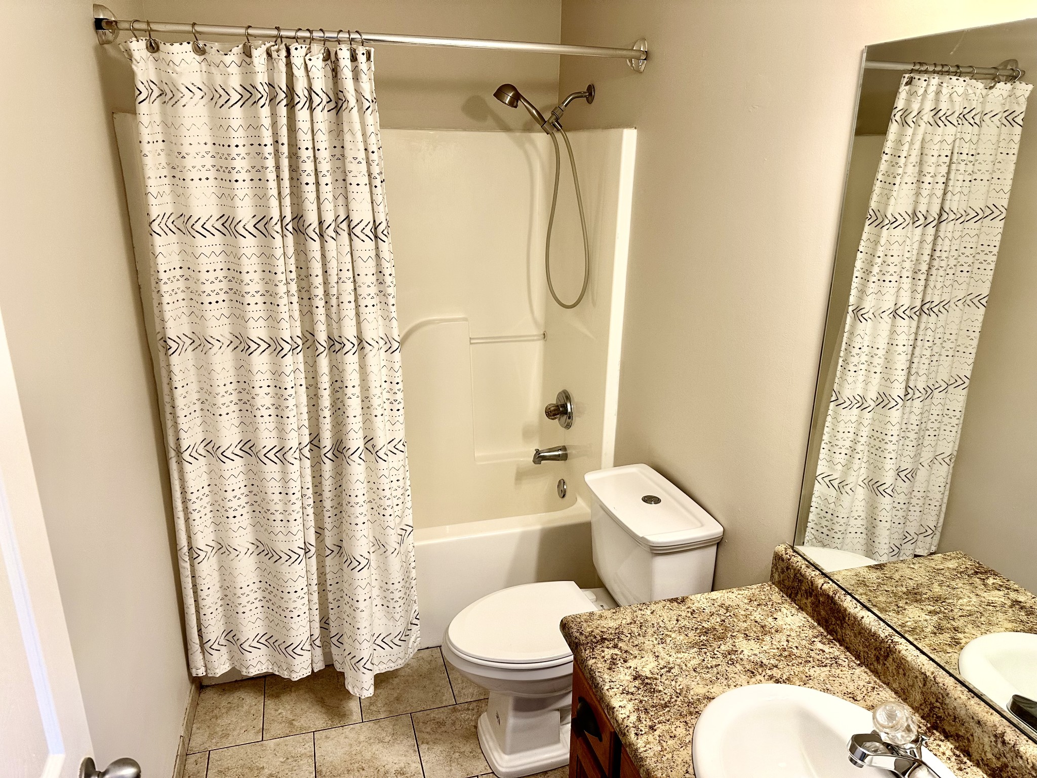 265 Sagewood Drive Pulaski, TN 38478 - Photo 11 of 16 a bathroom with a granite countertop toilet a sink and a shower