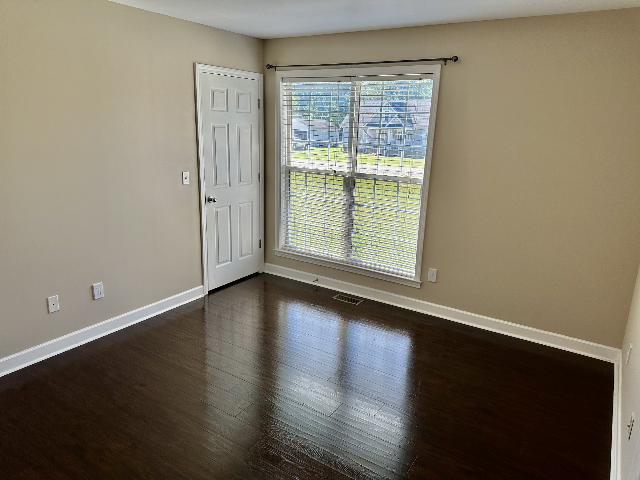 265 Sagewood Drive Pulaski, TN 38478 - Photo 12 of 16 an empty room with wooden floor and windows