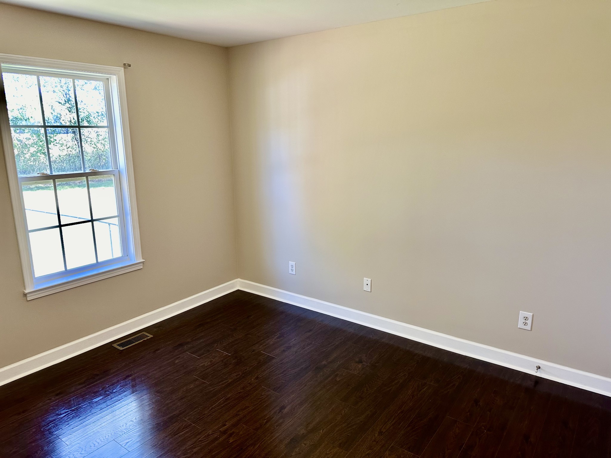 265 Sagewood Drive Pulaski, TN 38478 - Photo 13 of 16 a view of an empty room with wooden floor and a window