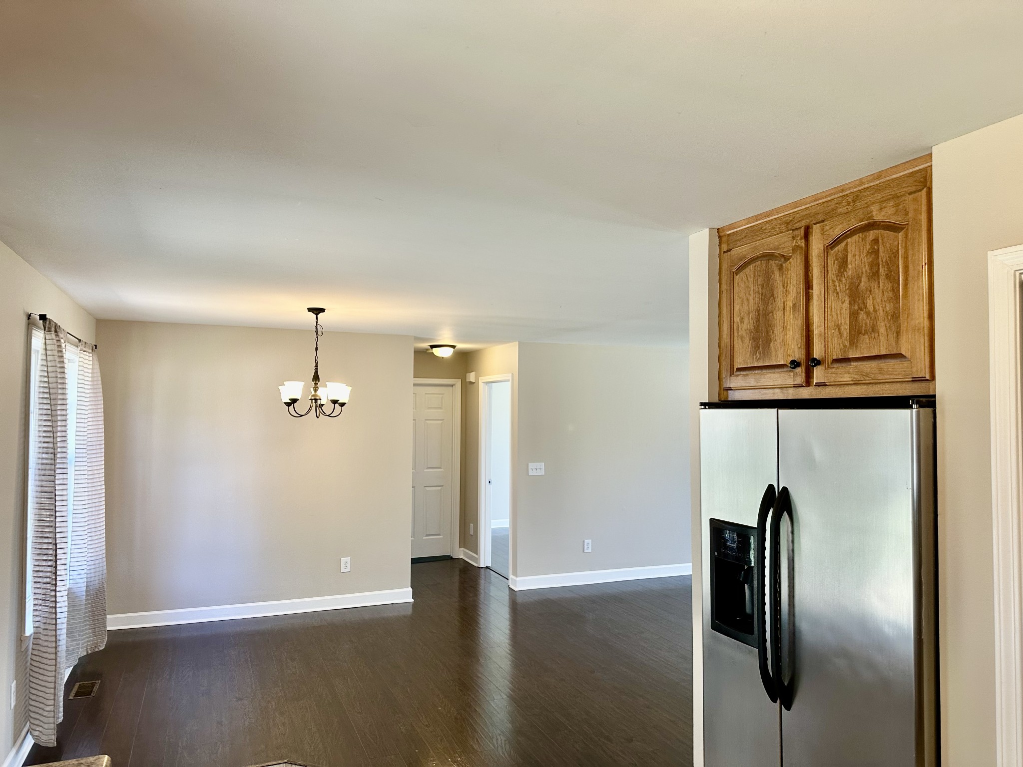265 Sagewood Drive Pulaski, TN 38478 - Photo 8 of 16 a view of an empty room with wooden floor and a window
