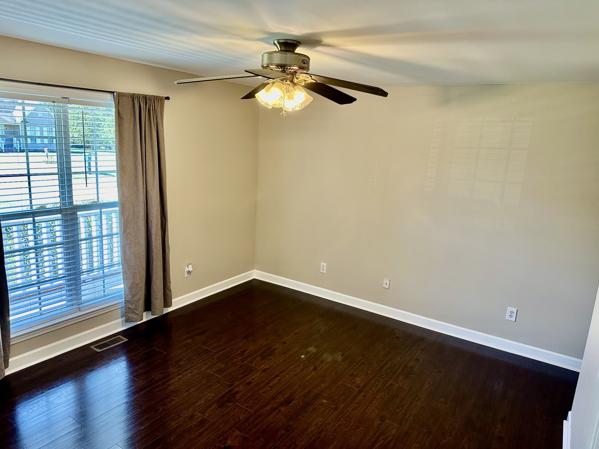 265 Sagewood Drive Pulaski, TN 38478 - Photo 10 of 16 a view of an empty room with wooden floor and a window