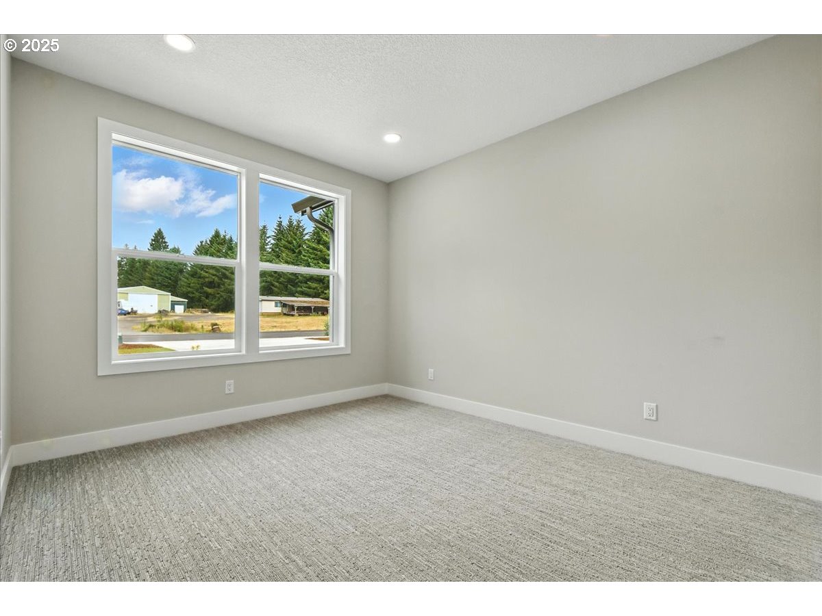 121 Gassman Road Castle Rock, WA 98611 - Photo 18 of 29 a view of an empty room with a window