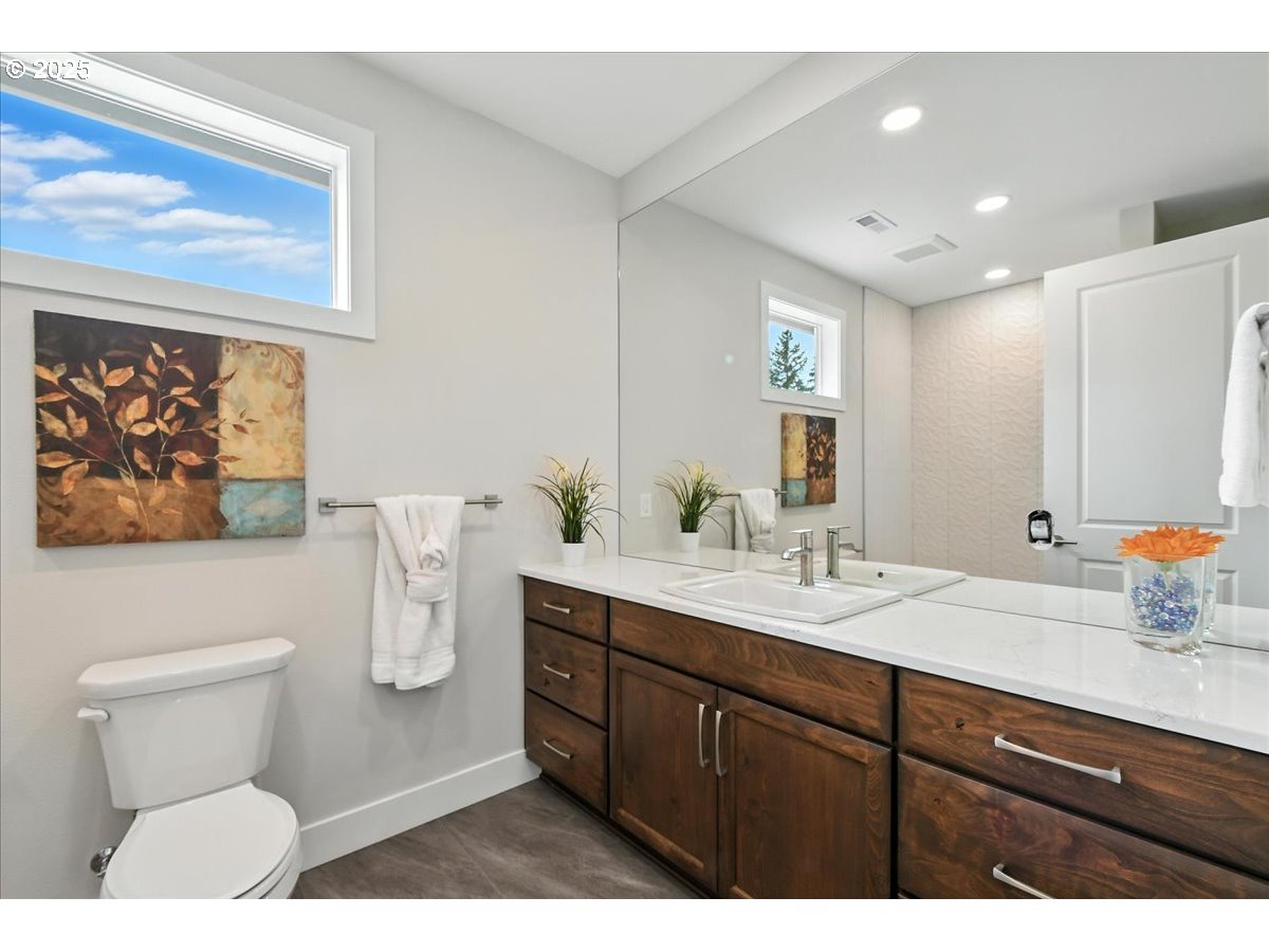121 Gassman Road Castle Rock, WA 98611 - Photo 19 of 29 a bathroom with a sink a toilet and a mirror