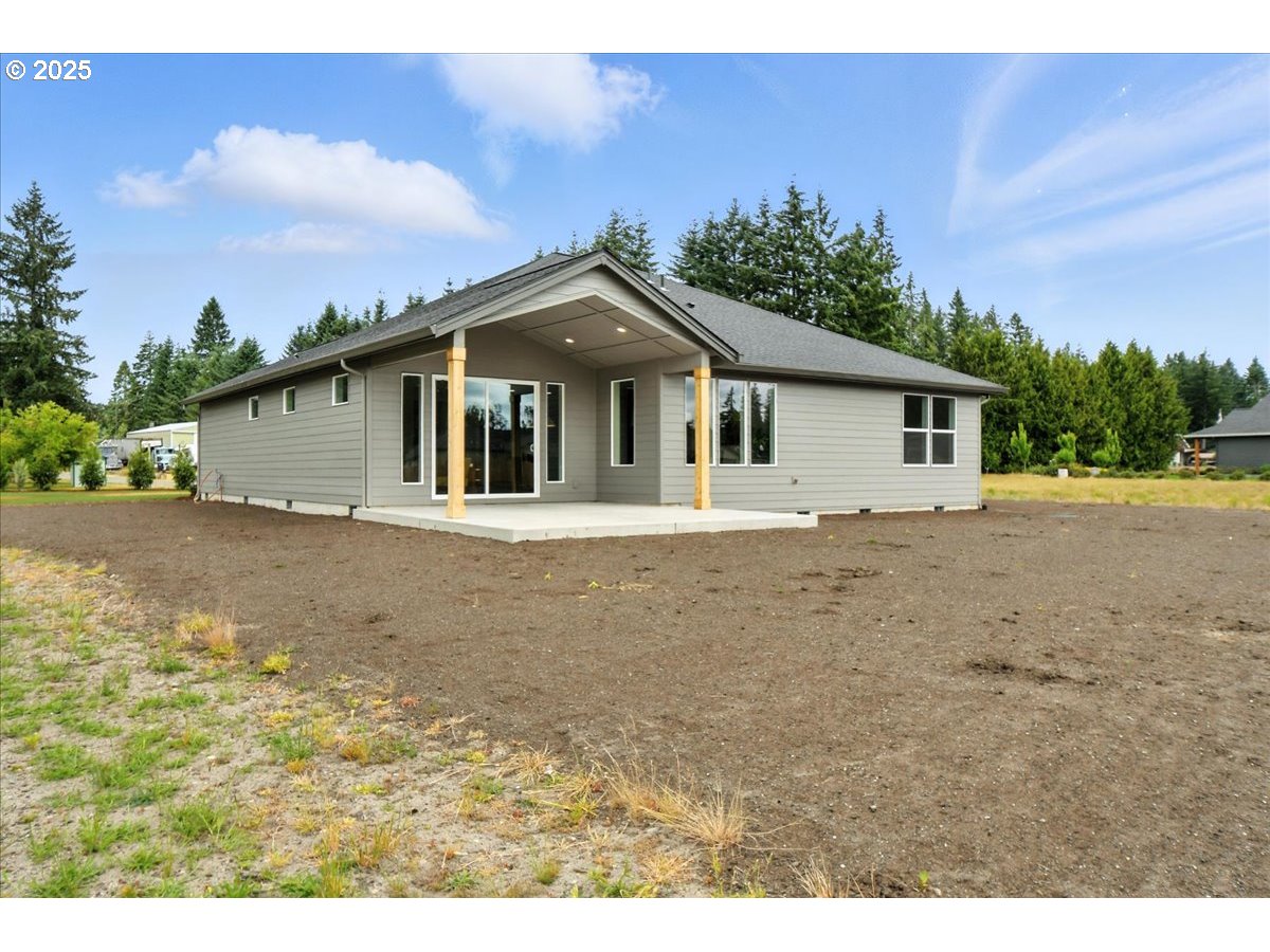 121 Gassman Road Castle Rock, WA 98611 - Photo 23 of 29 a front view of a house with a garden