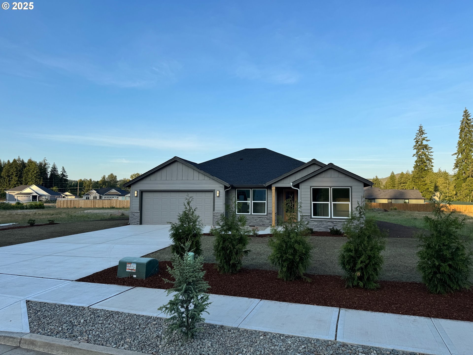 121 Gassman Road Castle Rock, WA 98611 - Photo 4 of 29 a view of a house with a yard