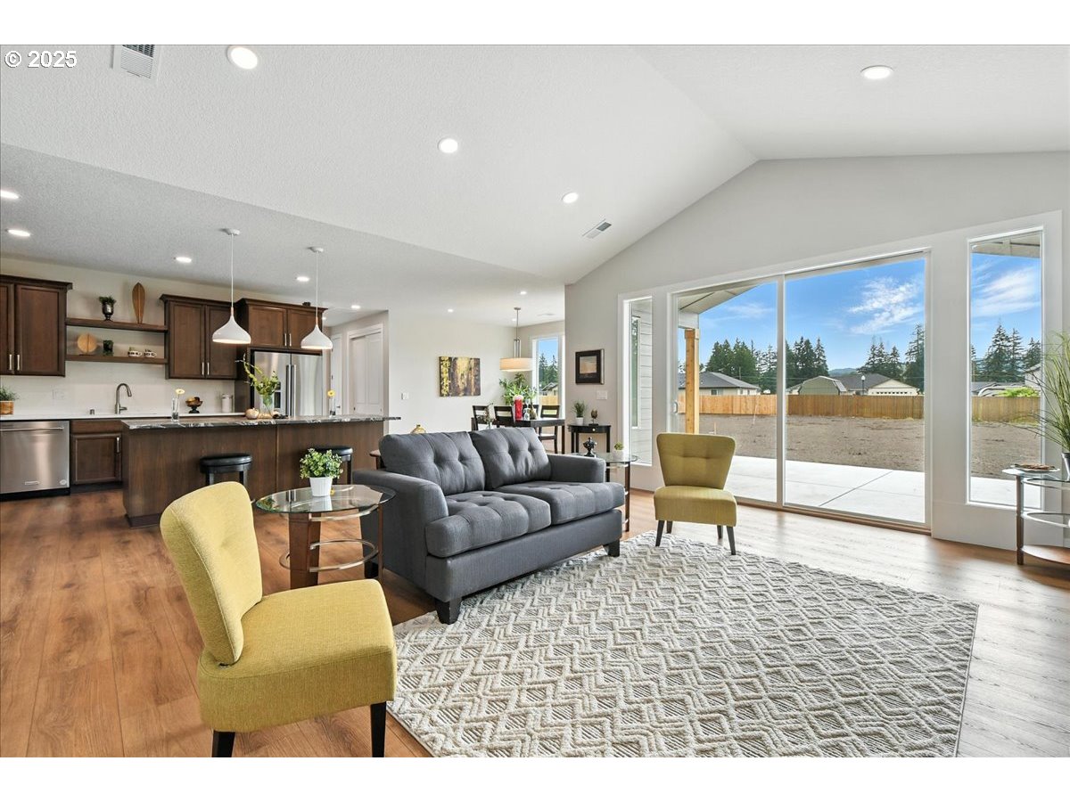 121 Gassman Road Castle Rock, WA 98611 - Photo 5 of 29 a living room with furniture and a view of kitchen