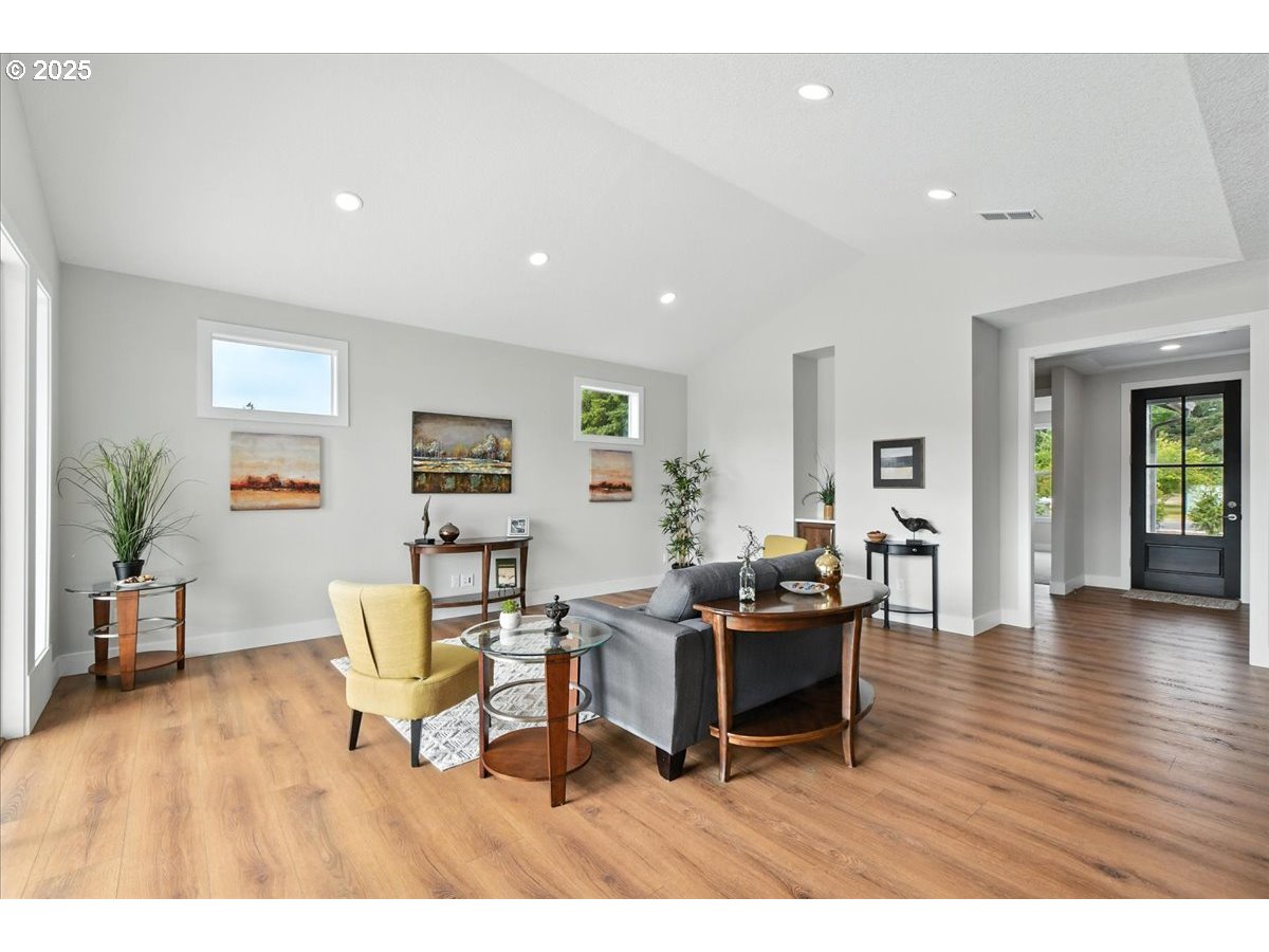 121 Gassman Road Castle Rock, WA 98611 - Photo 7 of 29 a living room with furniture and wooden floor