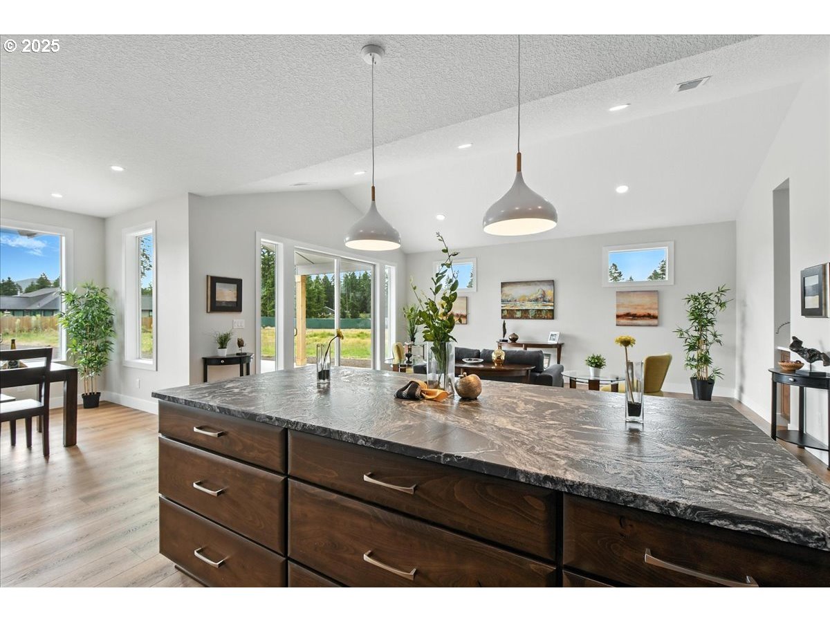 121 Gassman Road Castle Rock, WA 98611 - Photo 8 of 29 a kitchen with lots of counter top space and living room