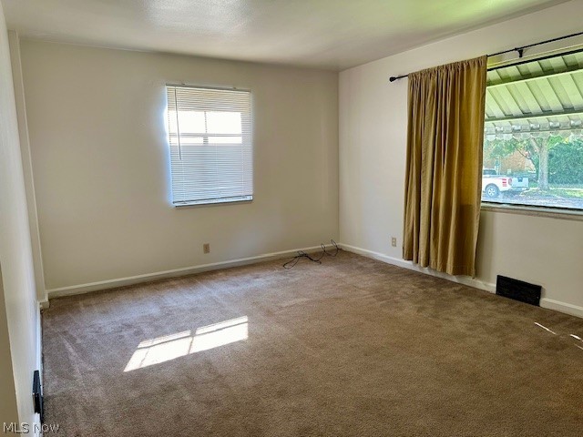 751 Thayer Street, Unit DOWN Akron, OH 44310 - Photo 3 of 25 View of carpeted empty room