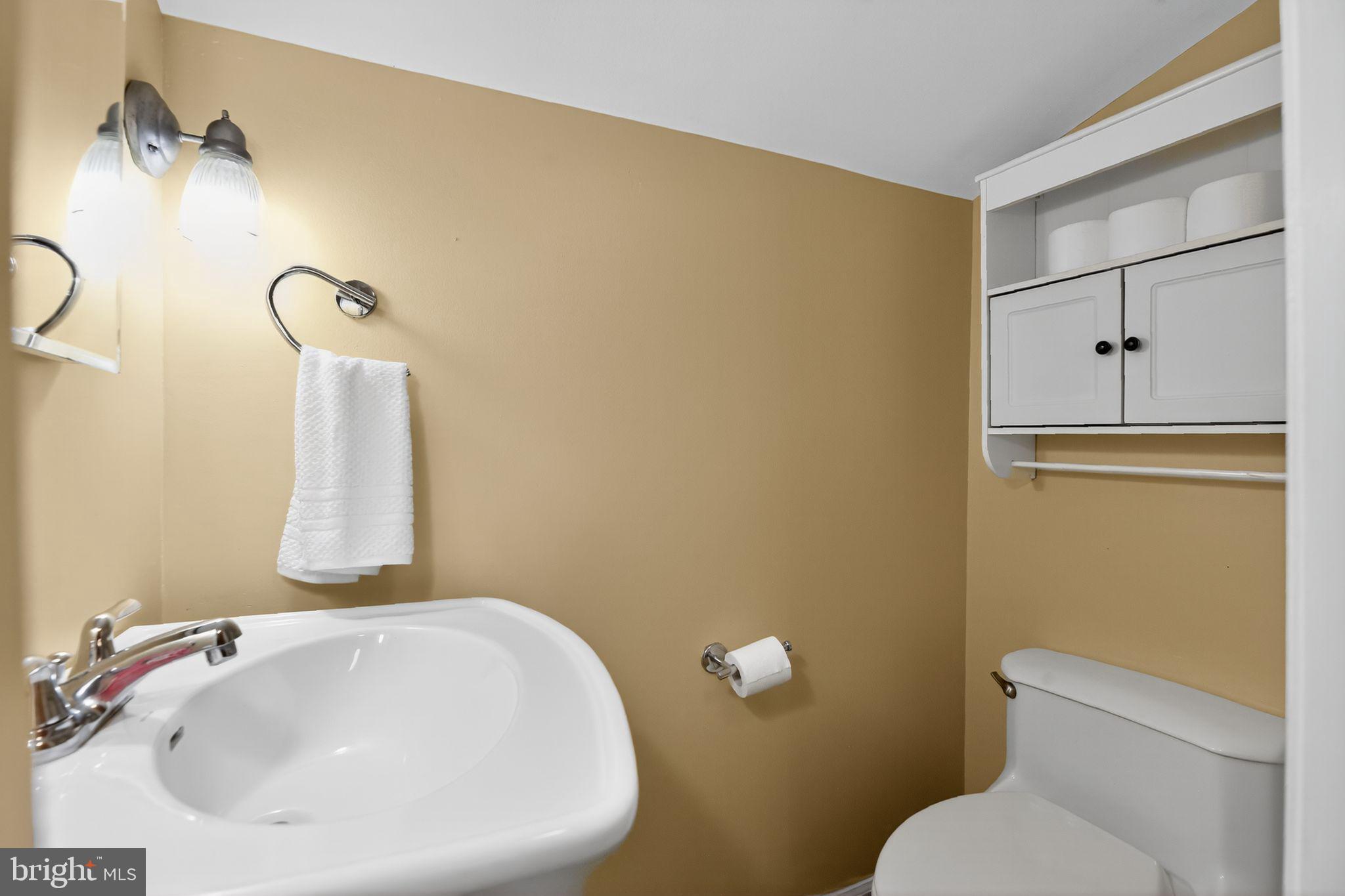 1115 Bridgeboro Road Beverly, NJ 08010 - Photo 16 of 39 a bathroom with a sink and a toilet
