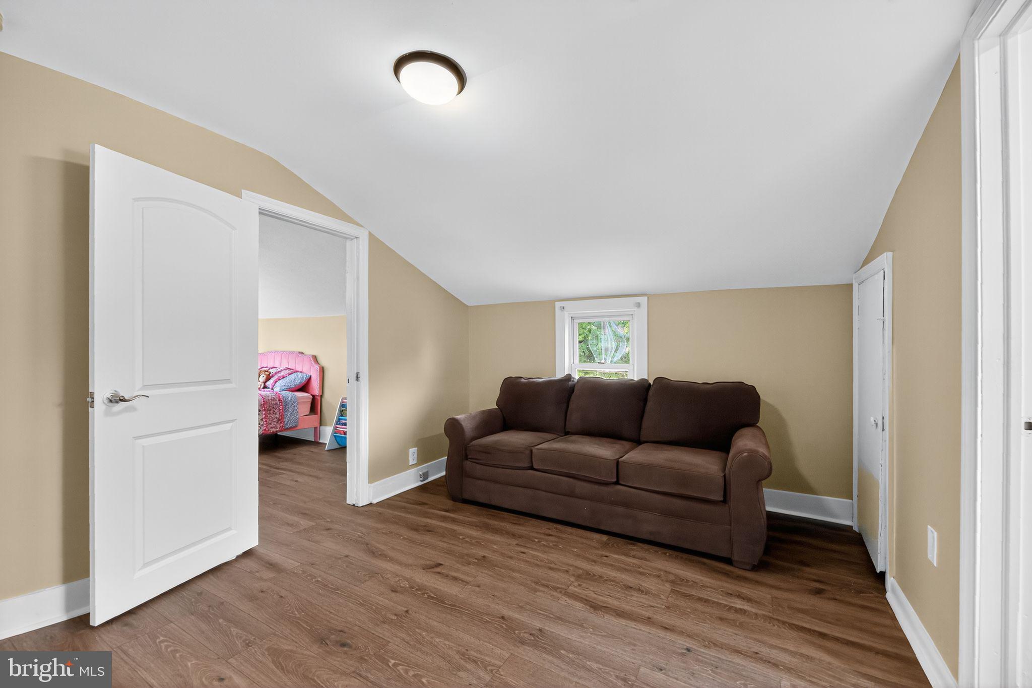 1115 Bridgeboro Road Beverly, NJ 08010 - Photo 19 of 39 a living room with furniture and a wooden floor