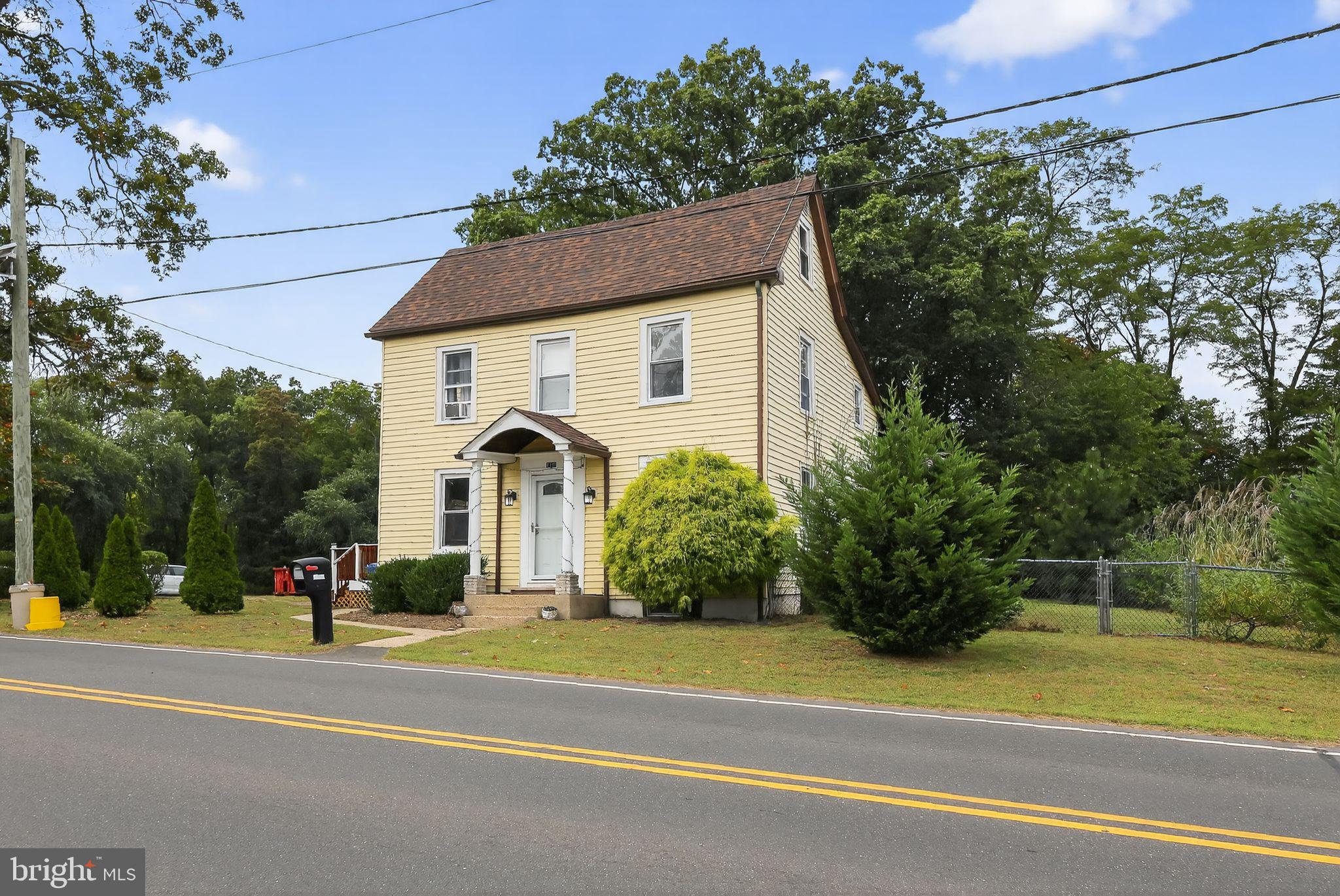 1115 Bridgeboro Road Beverly, NJ 08010 - Photo 2 of 39 a view of a house with a yard and large trees