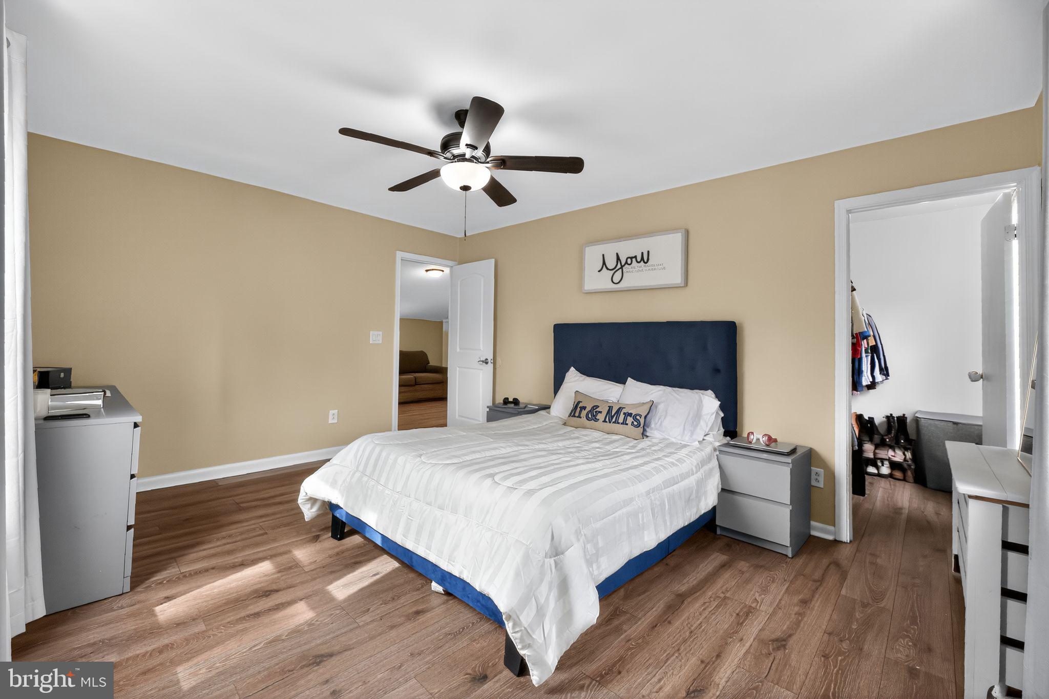 1115 Bridgeboro Road Beverly, NJ 08010 - Photo 21 of 39 a bedroom with a bed and a chandelier