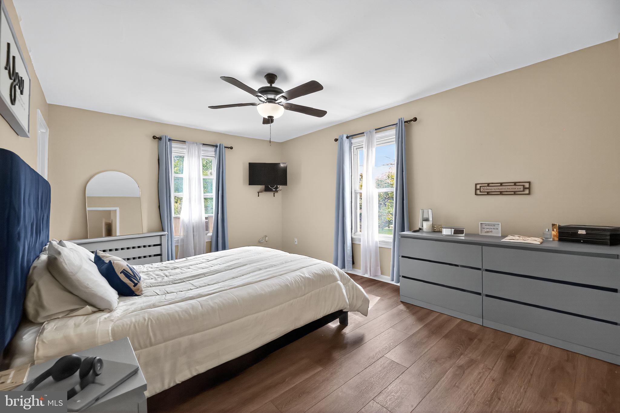 1115 Bridgeboro Road Beverly, NJ 08010 - Photo 22 of 39 a bedroom with a large bed and a chandelier