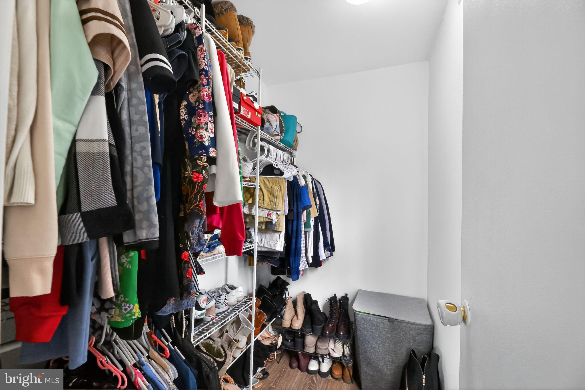 1115 Bridgeboro Road Beverly, NJ 08010 - Photo 24 of 39 a view of walk in closet with clothes and shoes
