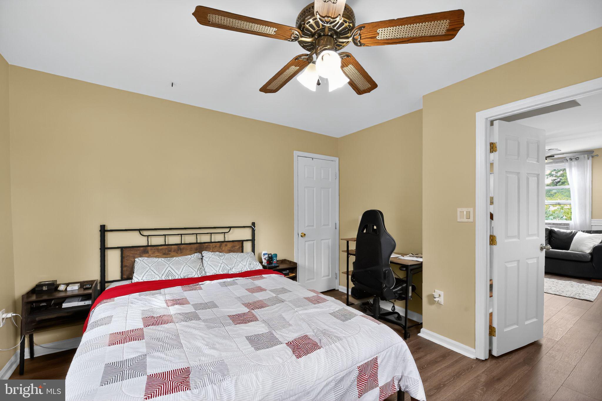 1115 Bridgeboro Road Beverly, NJ 08010 - Photo 27 of 39 a bedroom with a bed and a chandelier