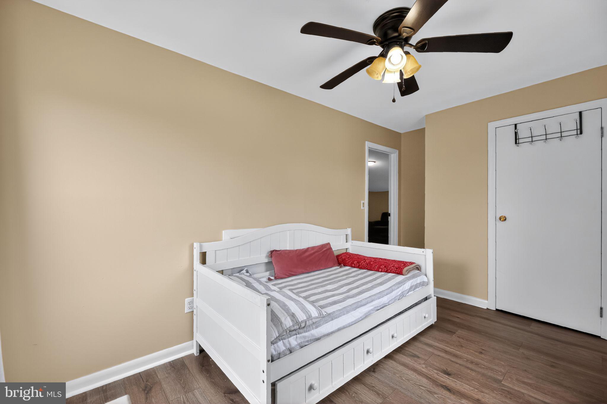1115 Bridgeboro Road Beverly, NJ 08010 - Photo 28 of 39 a bedroom with a bed and a ceiling fan