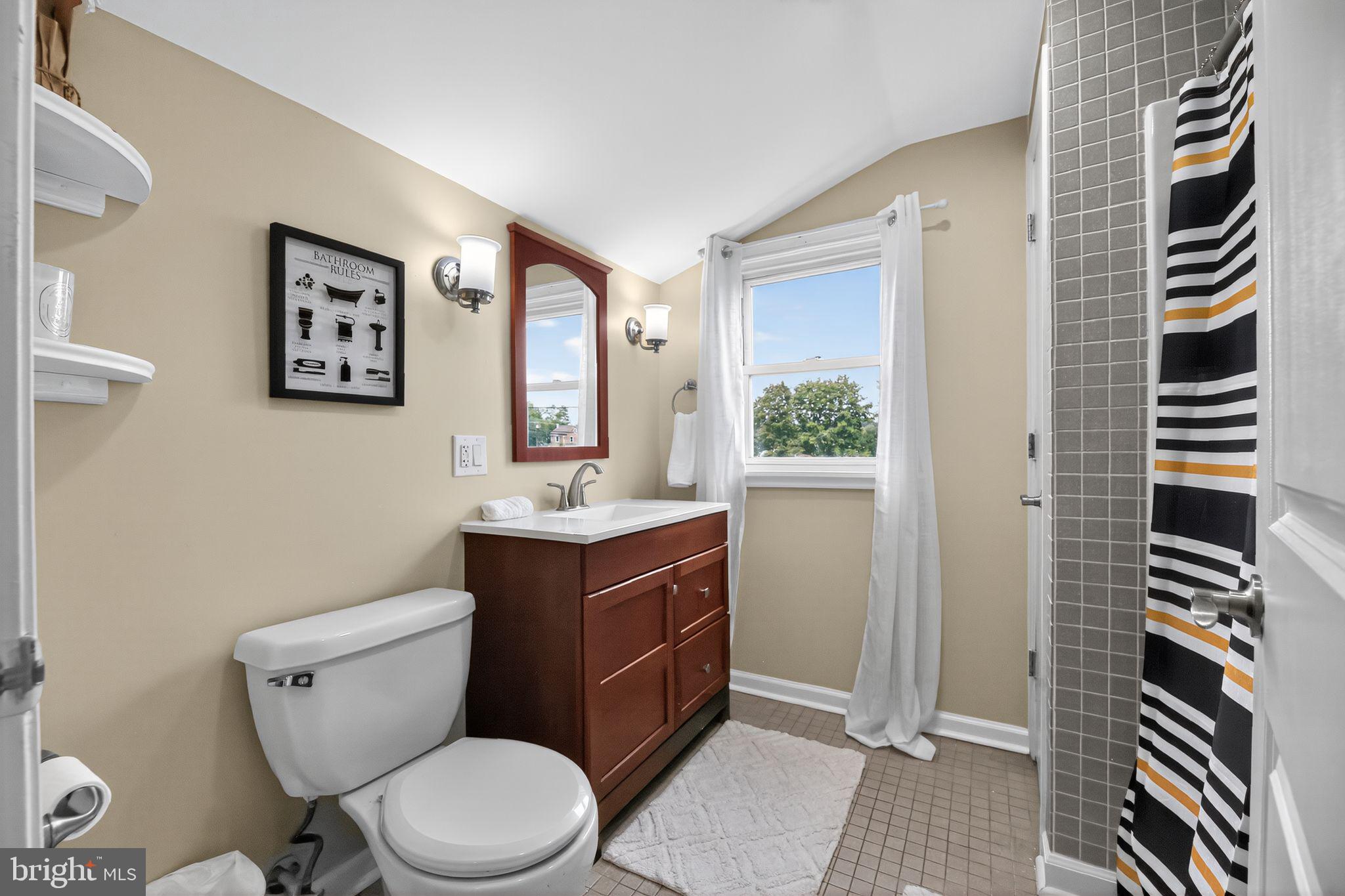 1115 Bridgeboro Road Beverly, NJ 08010 - Photo 29 of 39 a bathroom with a toilet a sink and mirror