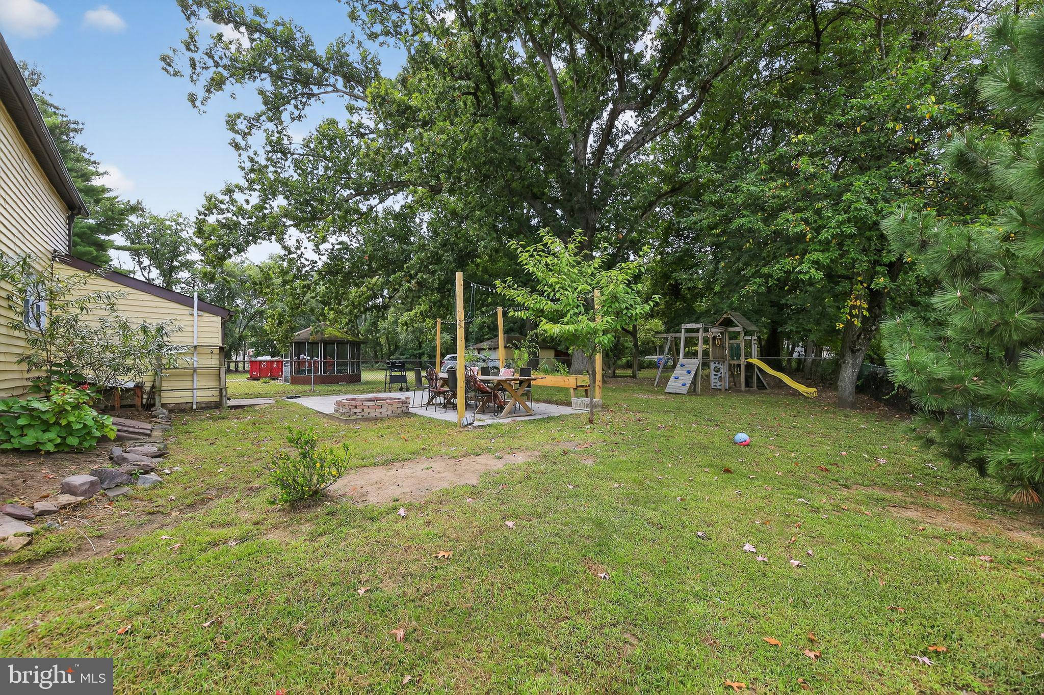 1115 Bridgeboro Road Beverly, NJ 08010 - Photo 37 of 39 a view of a garden with a slide