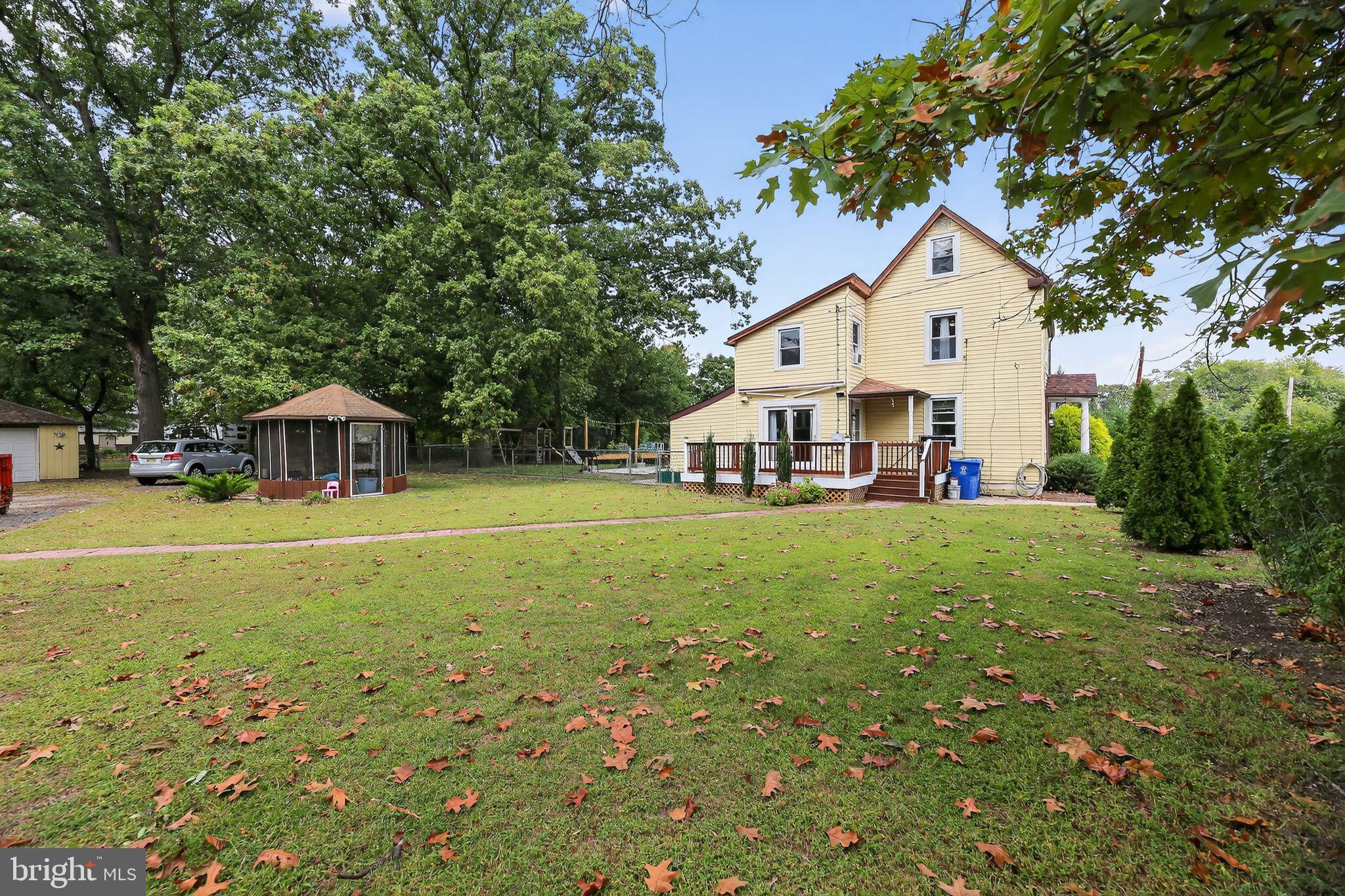 1115 Bridgeboro Road Beverly, NJ 08010 - Photo 4 of 39 a view of a house with a yard
