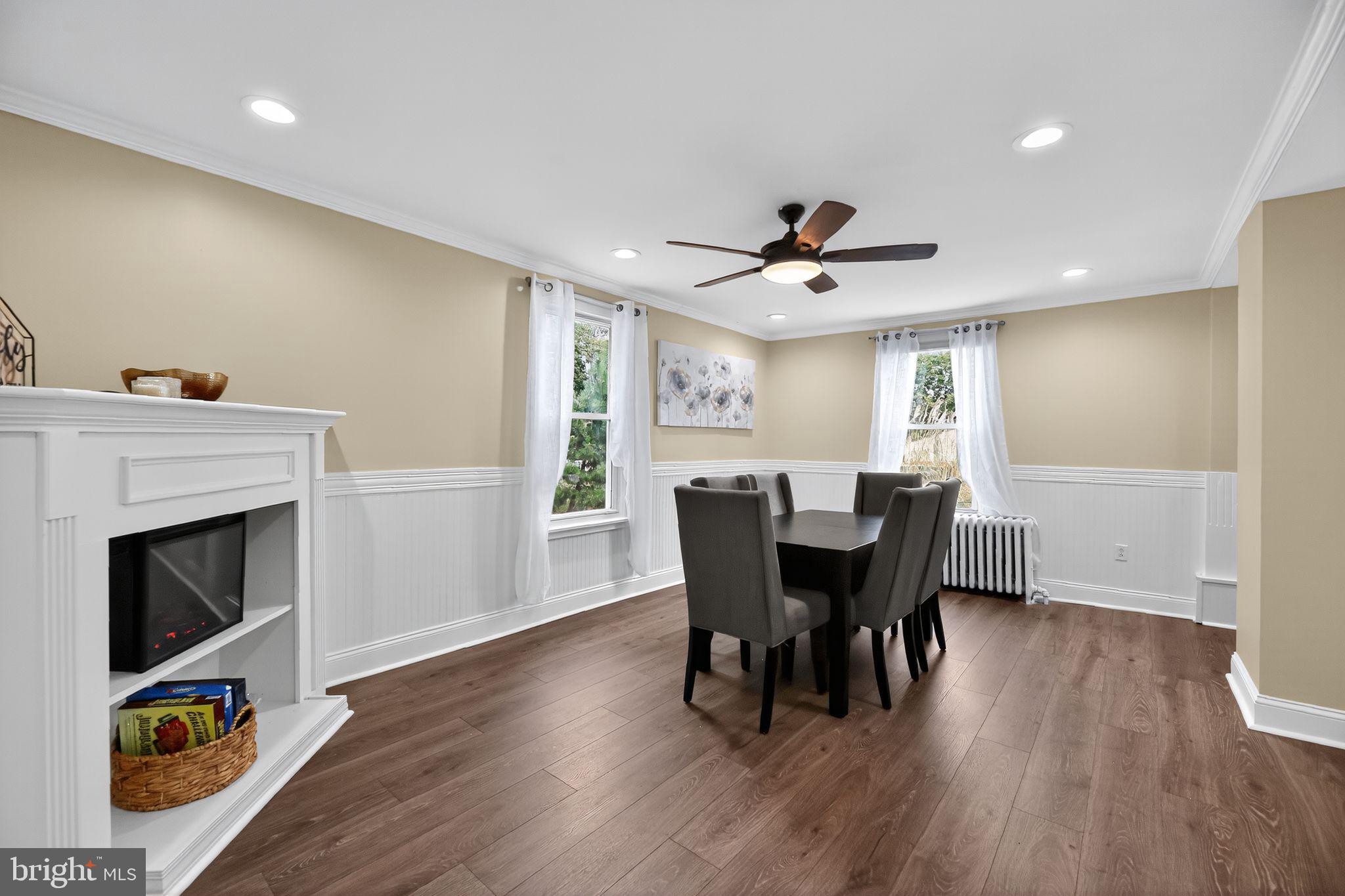 1115 Bridgeboro Road Beverly, NJ 08010 - Photo 9 of 39 a view of a dining room with furniture a rug and wooden floor