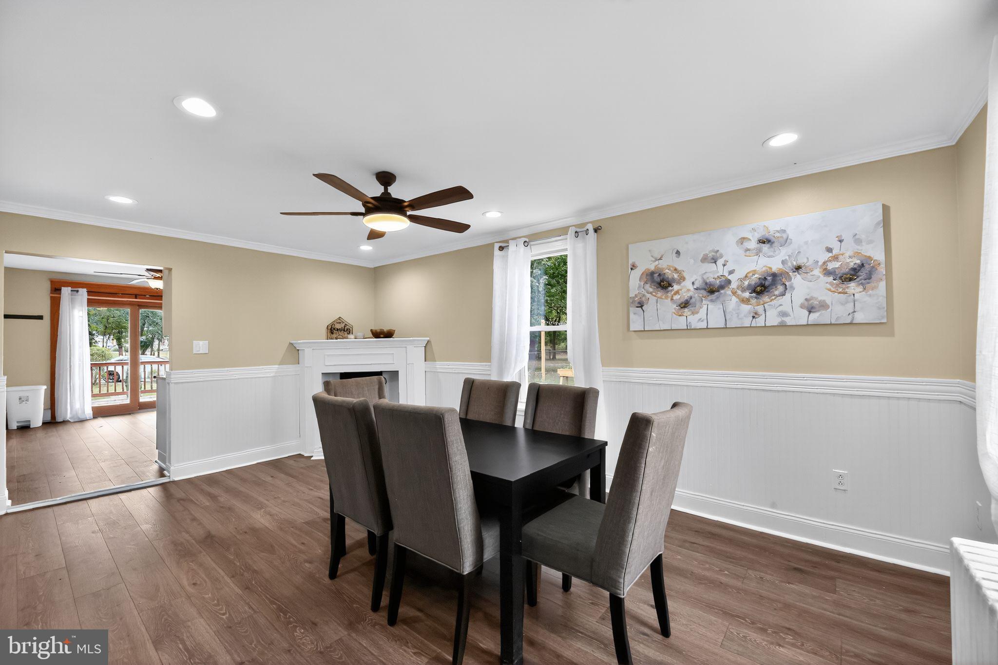 1115 Bridgeboro Road Beverly, NJ 08010 - Photo 10 of 39 a view of a dining room with furniture window and wooden floor