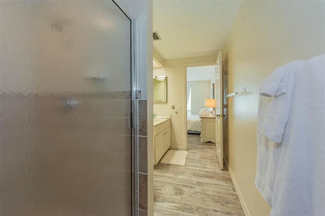 a bathroom with a shower and a sink