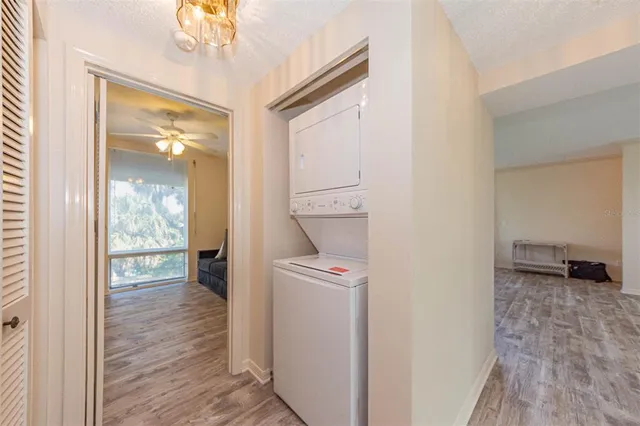 a view of a hallway view with wooden floor and staircase