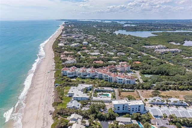 an aerial view of a city with ocean view