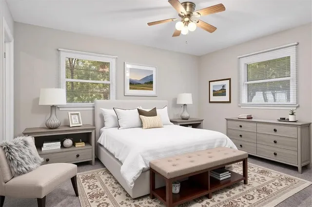 a bedroom with a bed and a couch