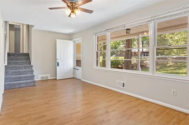 a view of an empty room with a window