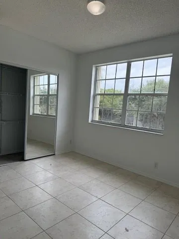a bathroom with a shower and a bath tub