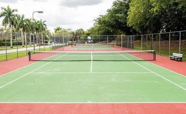 a view of wooden floor and a fence