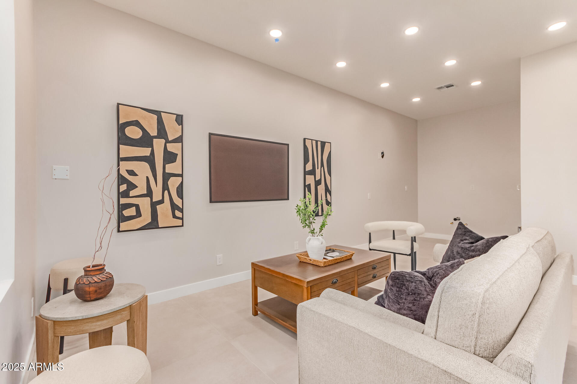 3301 East Rovey Avenue Paradise Valley, AZ 85253 - Photo 74 of 105 a living room with furniture and a flat screen tv