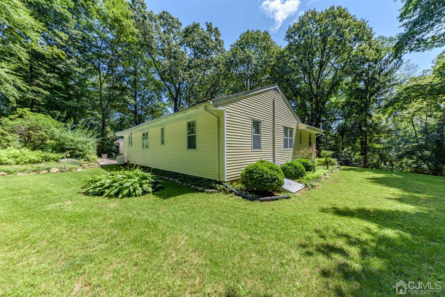 363 Rockport Road Port Murray, NJ 07865 - Photo 23 of 23 a view of backyard with large trees and plants