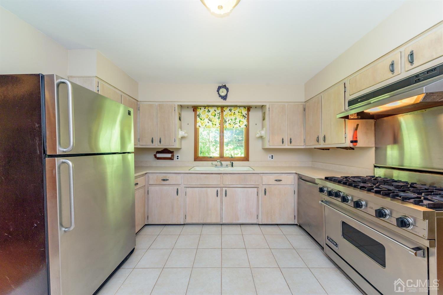 363 Rockport Road Port Murray, NJ 07865 - Photo 8 of 23 a kitchen with a refrigerator a stove a sink and a window